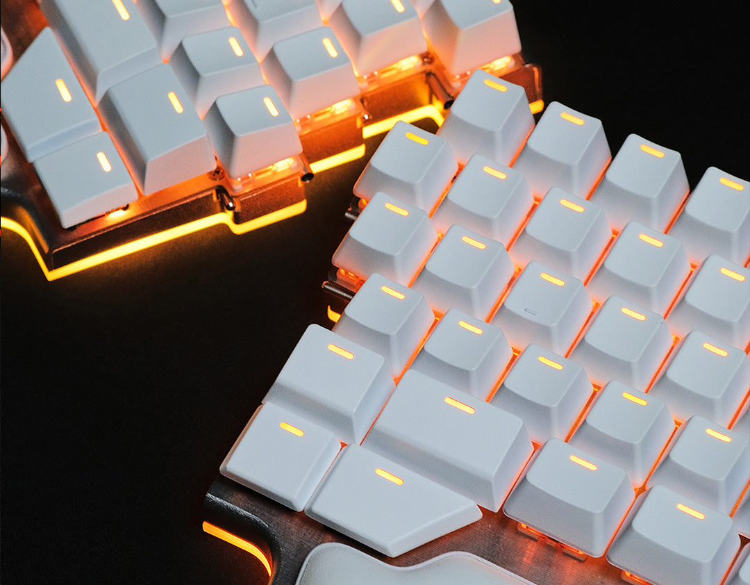 Image of the Raise 2 with white key caps and orange RGBW under glow 